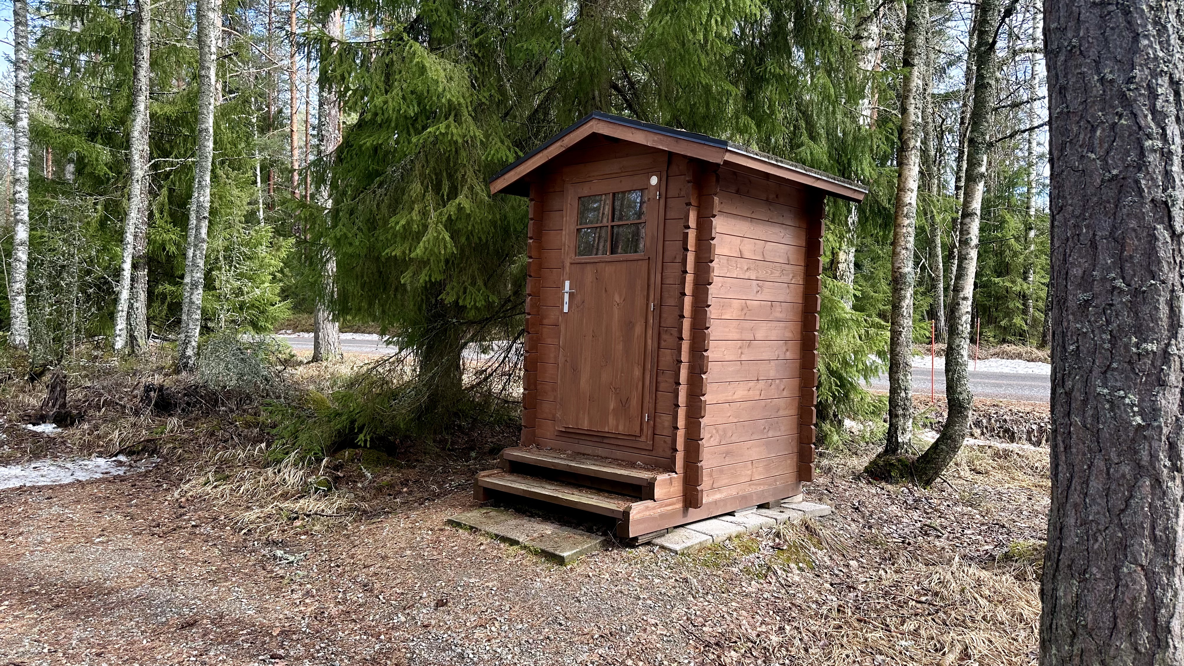 Wooden outdoor dry toilet.